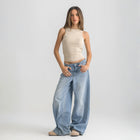 beige ribbed basic tank top for women, front view showcasing fitted silhouette and minimal design.