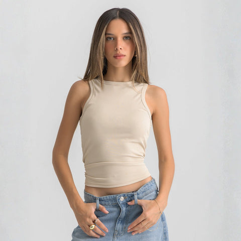 beige ribbed basic tank top for women, front view showcasing fitted silhouette and minimal design.
