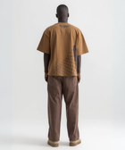 Back view of burnt brown cotton t-shirt featuring broken chain-link fence print.