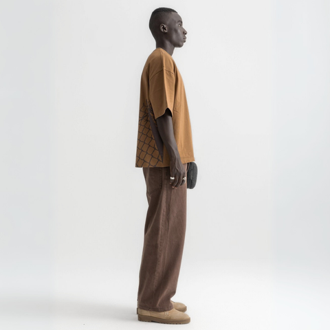 Unisex burnt brown box-fit tee with oversized distressed key graphic on the front