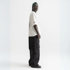 Unisex white box-fit tee in heavyweight Egyptian cotton with worn cassette tape graphic across the chest. and abstract equalizer design on back. 