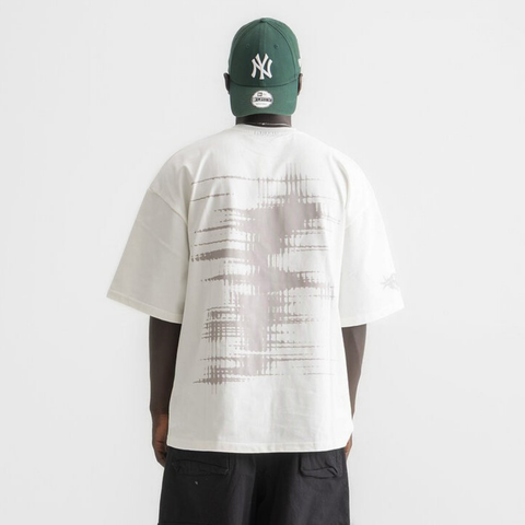 Unisex white box-fit tee in heavyweight Egyptian cotton with worn cassette tape graphic across the chest. and abstract equalizer design on back. 