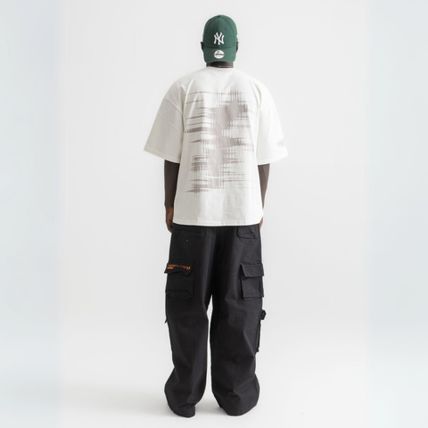 Unisex white box-fit tee in heavyweight Egyptian cotton with worn cassette tape graphic across the chest. and abstract equalizer design on back. 