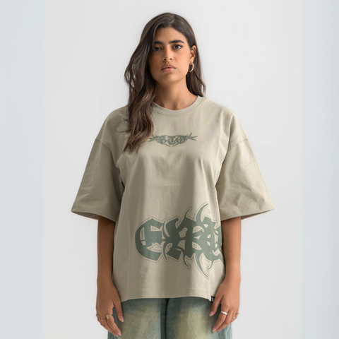 Unisex sage green box-fit tee with distressed BTO logo on chest and washed-out ENTROPY print wrapping from chest to back