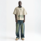 Unisex sage green box-fit tee with distressed BTO logo on chest and washed-out ENTROPY print wrapping from chest to back