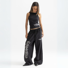Unisex black baggy sweatpants with chunky waistband, raw pocket detailing, and light grey grunge print.