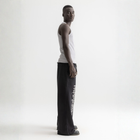 Men’s grey ribbed tank top, side view showcasing fitted silhouette and minimal design