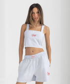 Striped Ocean Blue and White cropped cotton top with burgundy ‘Humble’ embroidery on front.