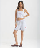 Striped Ocean Blue and White cropped cotton top with burgundy ‘Humble’ embroidery on front.