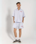 Unisex boxer-style shorts made from 100% breathable thick cotton. Featuring classic sailor stripes in ocean blue and white, rosé pink and white, or sand beige and white. Relaxed, slouchy fit with elastic waistband and adjustable drawstring for a comfortable, effortless look. Available in multiple colors.