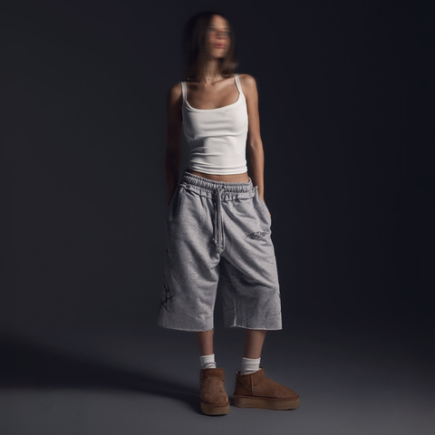 Unisex grey long shorts made of 100% cotton with raw hem edges and chunky waistband.
