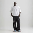 Men’s white box-fit oversized tee, front view showcasing relaxed fit and minimalist design.