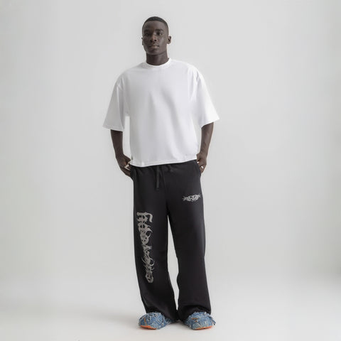 Men’s white box-fit oversized tee, front view showcasing relaxed fit and minimalist design.