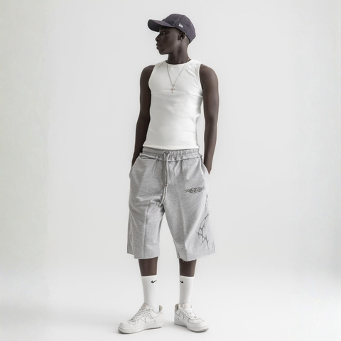 Men’s white ribbed tank top, front view showcasing fitted silhouette and minimal design