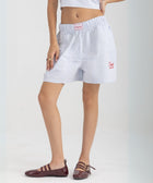 Unisex boxer-style shorts made from 100% breathable thick cotton. Featuring classic sailor stripes in ocean blue and white, rosé pink and white, or sand beige and white. Relaxed, slouchy fit with elastic waistband and adjustable drawstring for a comfortable, effortless look. 