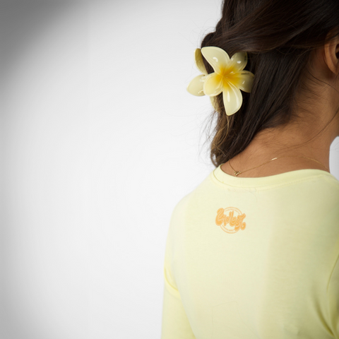 Sabah El lamoon Morning Market baby tee – in butter yellow with colorful silk-screen lemon front print, BTX x Nada Sultan