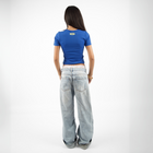 Sabah El torshy Morning Market baby tee – in blue with colorful silk-screen pickles front print, BTX x Nada Sultan