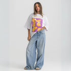 Oversized white t-shirt with bold Termes illustration, 100% cotton.