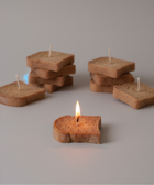BROWNTOAST TOAST Candle — realistic handcrafted toast-shaped candle made from natural palm wax. Unscented decorative candle. Part of the Dopamine Decor lifestyle drop.