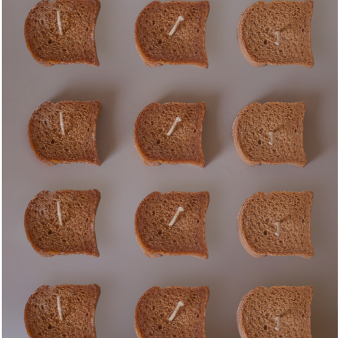 BROWNTOAST TOAST Candle — realistic handcrafted toast-shaped candle made from natural palm wax. Unscented decorative candle. Part of the Dopamine Decor lifestyle drop.